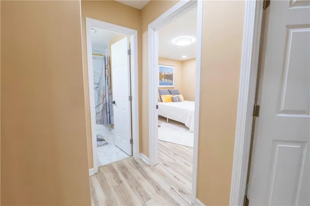 a view of a bathroom from a hallway