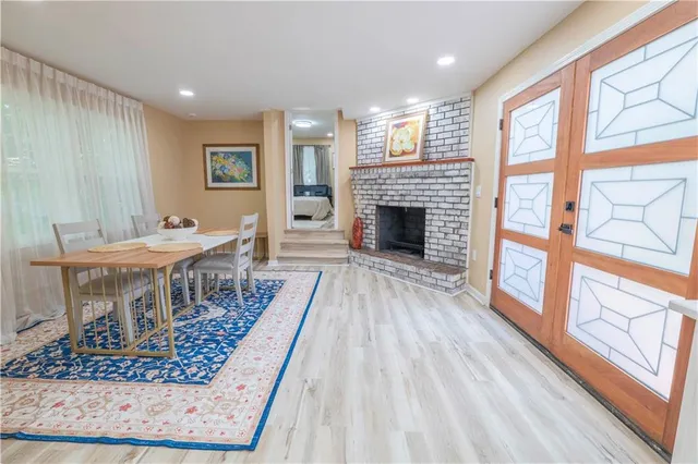a view of a livingroom with furniture window and wooden floor