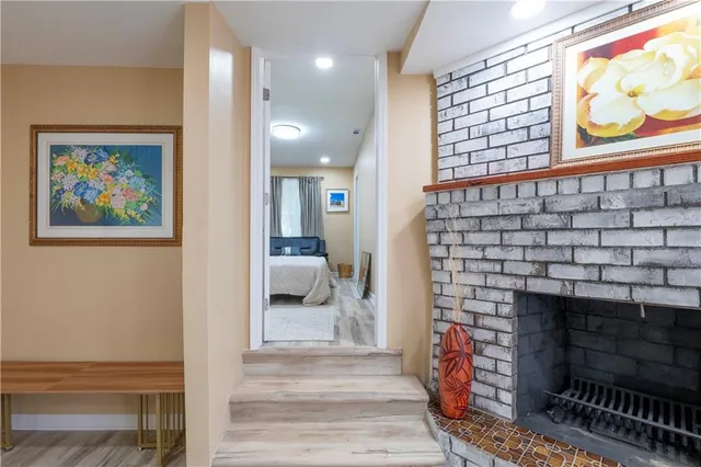 a living room with furniture a rug and a fireplace