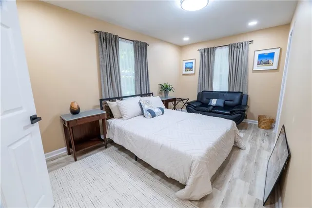 a bed room with a bed and a window