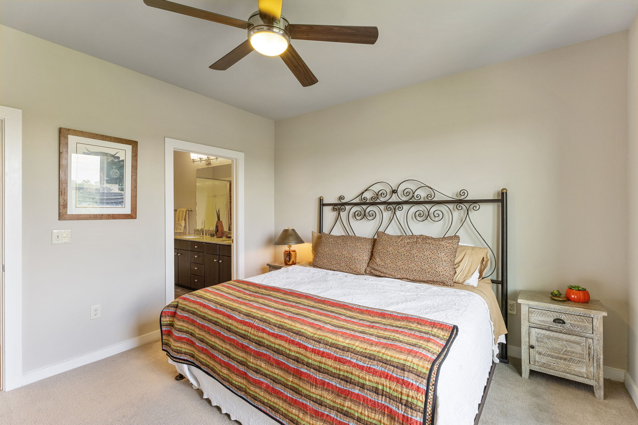 1900 Barton Springs Road, Unit 5032 Austin, TX 78704 - Photo 13 of 40 Bedroom featuring a ceiling fan with integrated lighting, neutral wall paint, and plush carpet flooring