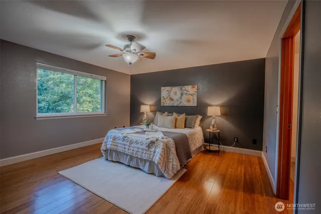 a bedroom with a bed and a window