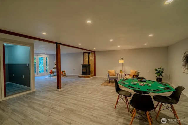 a dining room with furniture and wooden floor