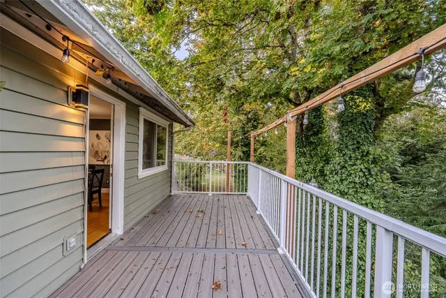 a view of a balcony with wooden floor