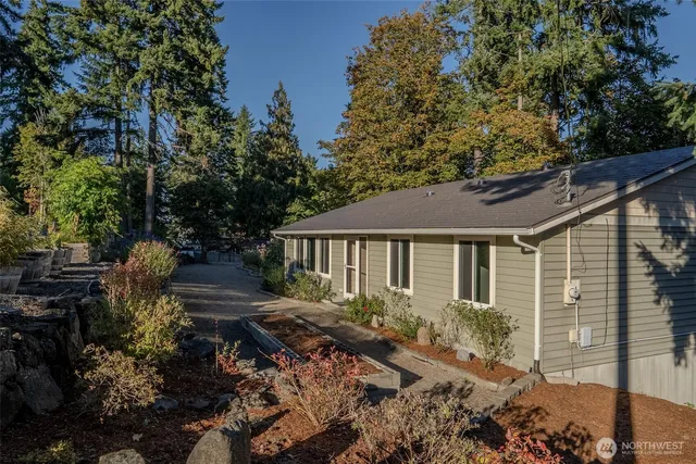 a backyard of a house with yard and outdoor seating
