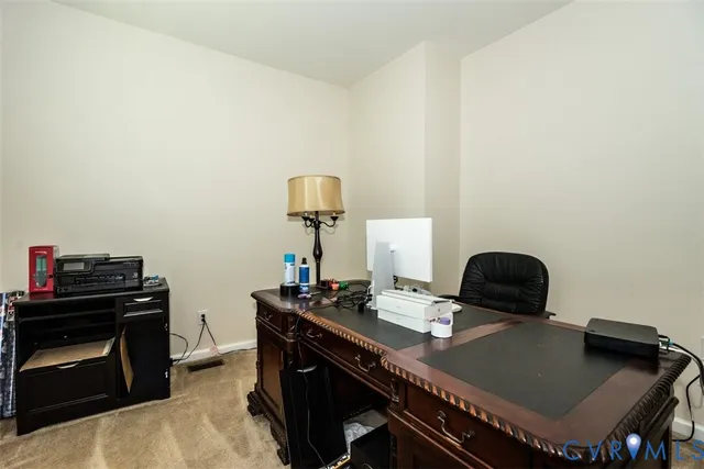 a spacious bedroom with a bed and a dresser