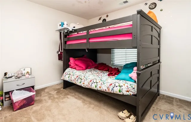 a room with a flat screen tv and a couch