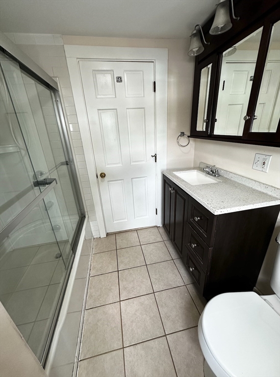 18 Boston Street, Unit RIGHT SIDE Middleton, MA 01949 - Photo 2 of 7 a bathroom with a sink a toilet and mirror