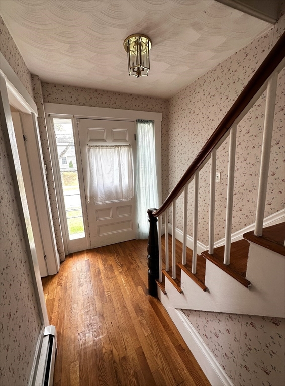 18 Boston Street, Unit RIGHT SIDE Middleton, MA 01949 - Photo 6 of 7 a view of entryway and hall with wooden floor