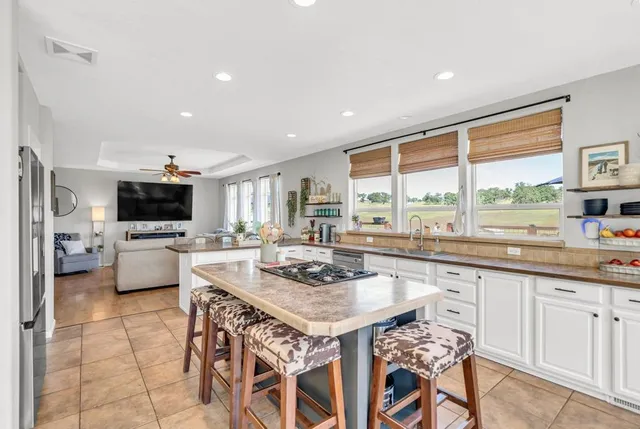 a view of a dining room with furniture and window