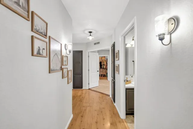 a bathroom with a sink vanity granite and a mirror