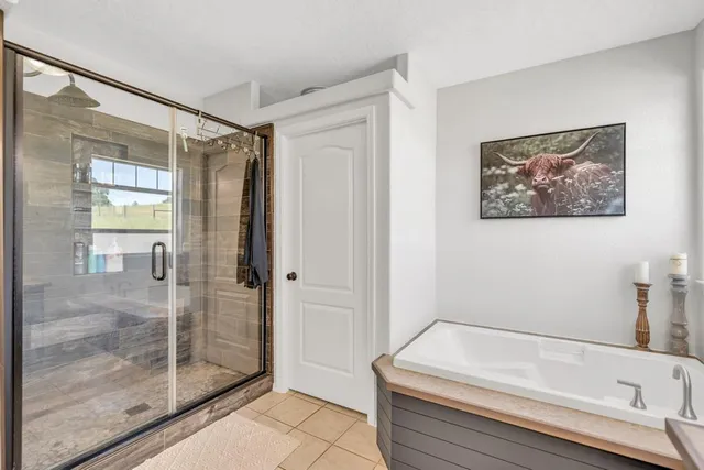 a kitchen with stainless steel appliances a refrigerator and a window