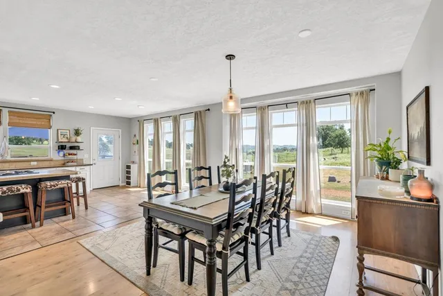 a kitchen with stainless steel appliances kitchen island granite countertop a sink and cabinets