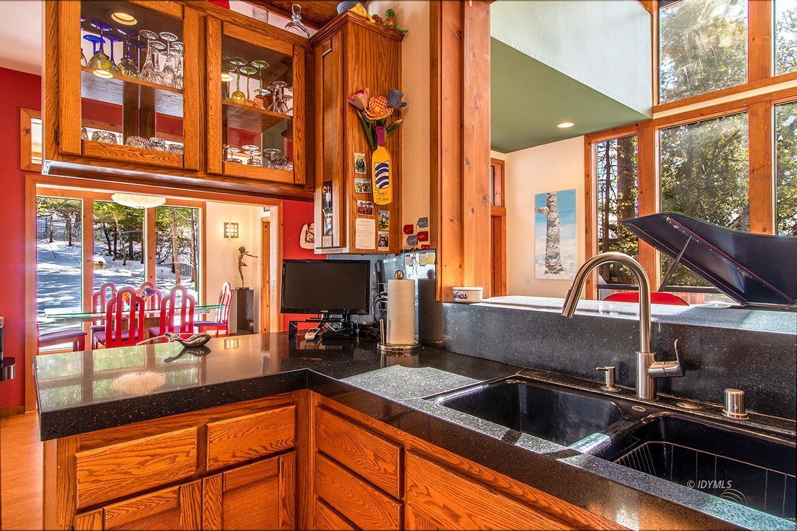 25440 Seneca Road Idyllwild, CA 92549 - Photo 13 of 68 a kitchen sink with an oven and large window
