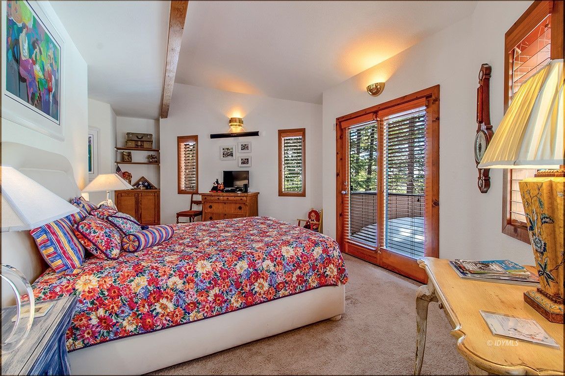 25440 Seneca Road Idyllwild, CA 92549 - Photo 32 of 68 a bedroom with bed and glass door