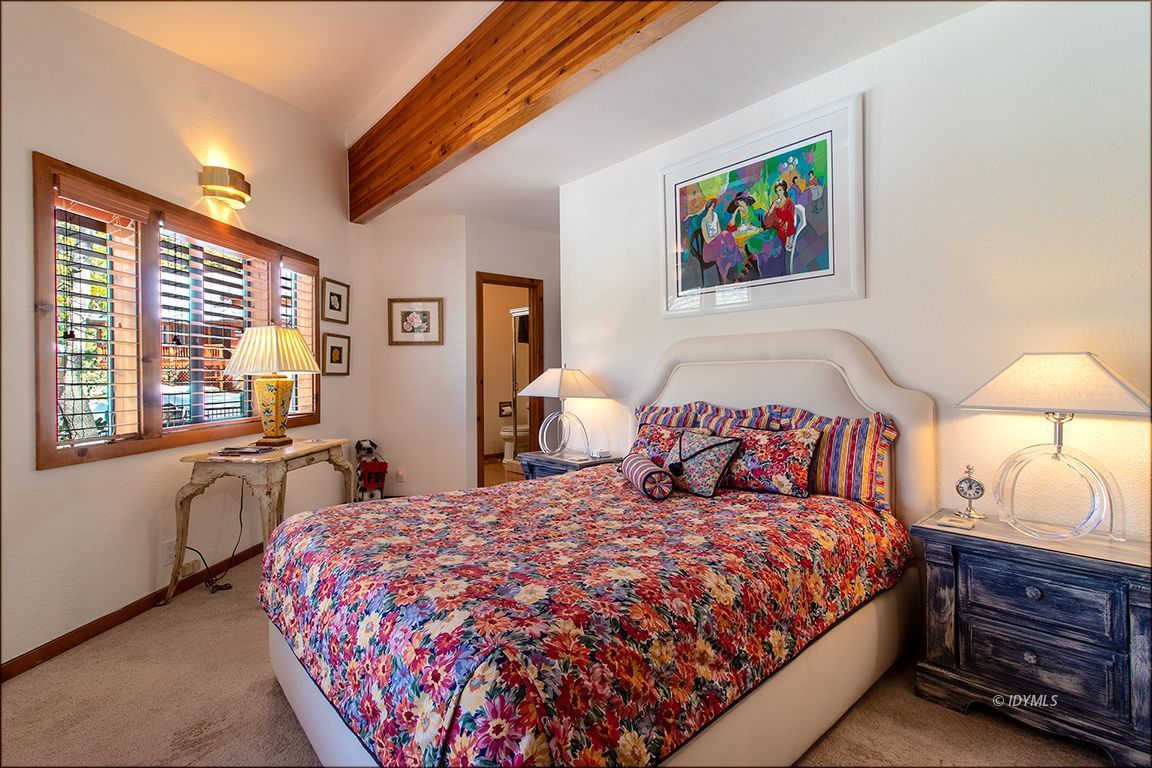 25440 Seneca Road Idyllwild, CA 92549 - Photo 33 of 68 a bedroom with a bed and a painting on the wall