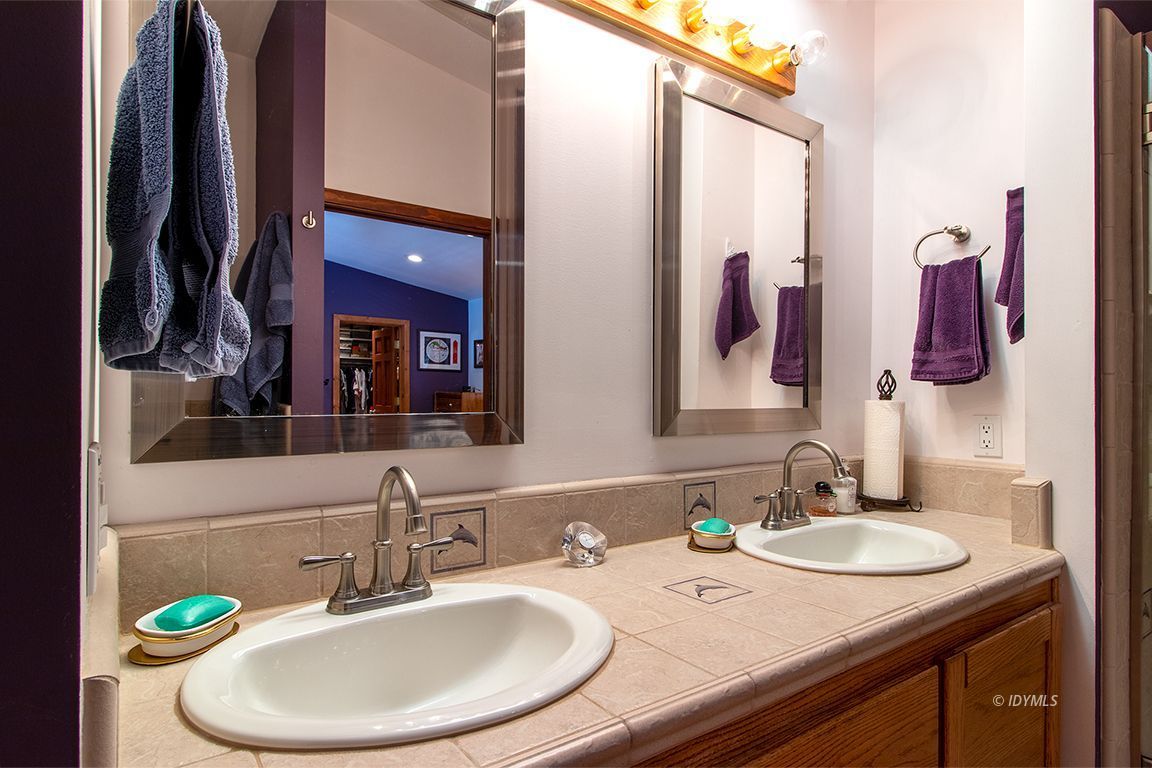 25440 Seneca Road Idyllwild, CA 92549 - Photo 41 of 68 a bathroom with a granite countertop sink and a mirror
