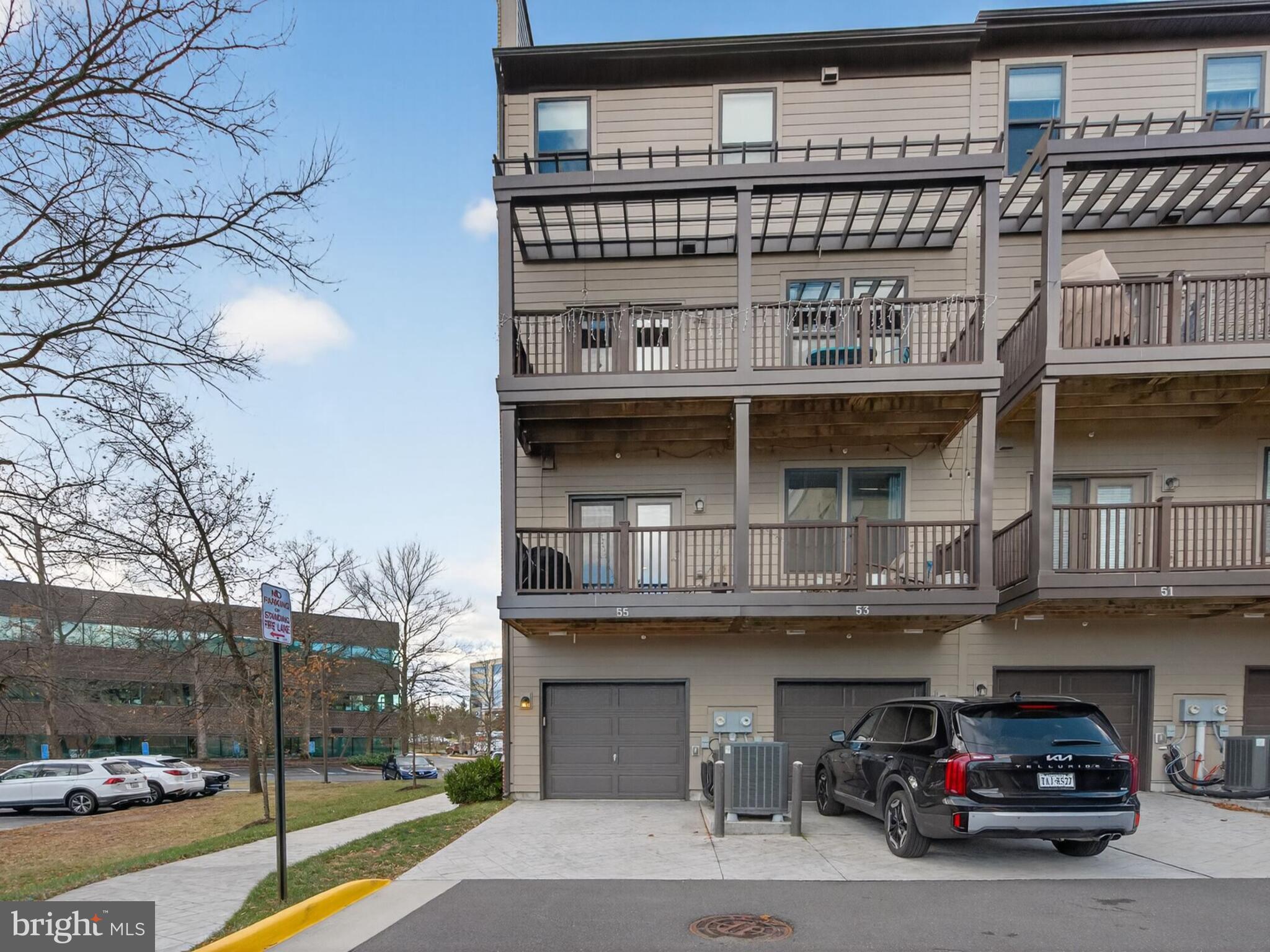 55 Silverway Drive, Unit 48 Herndon, VA 20170 - Photo 29 of 31 Back of Townhouse Condo with Rear Load Garage