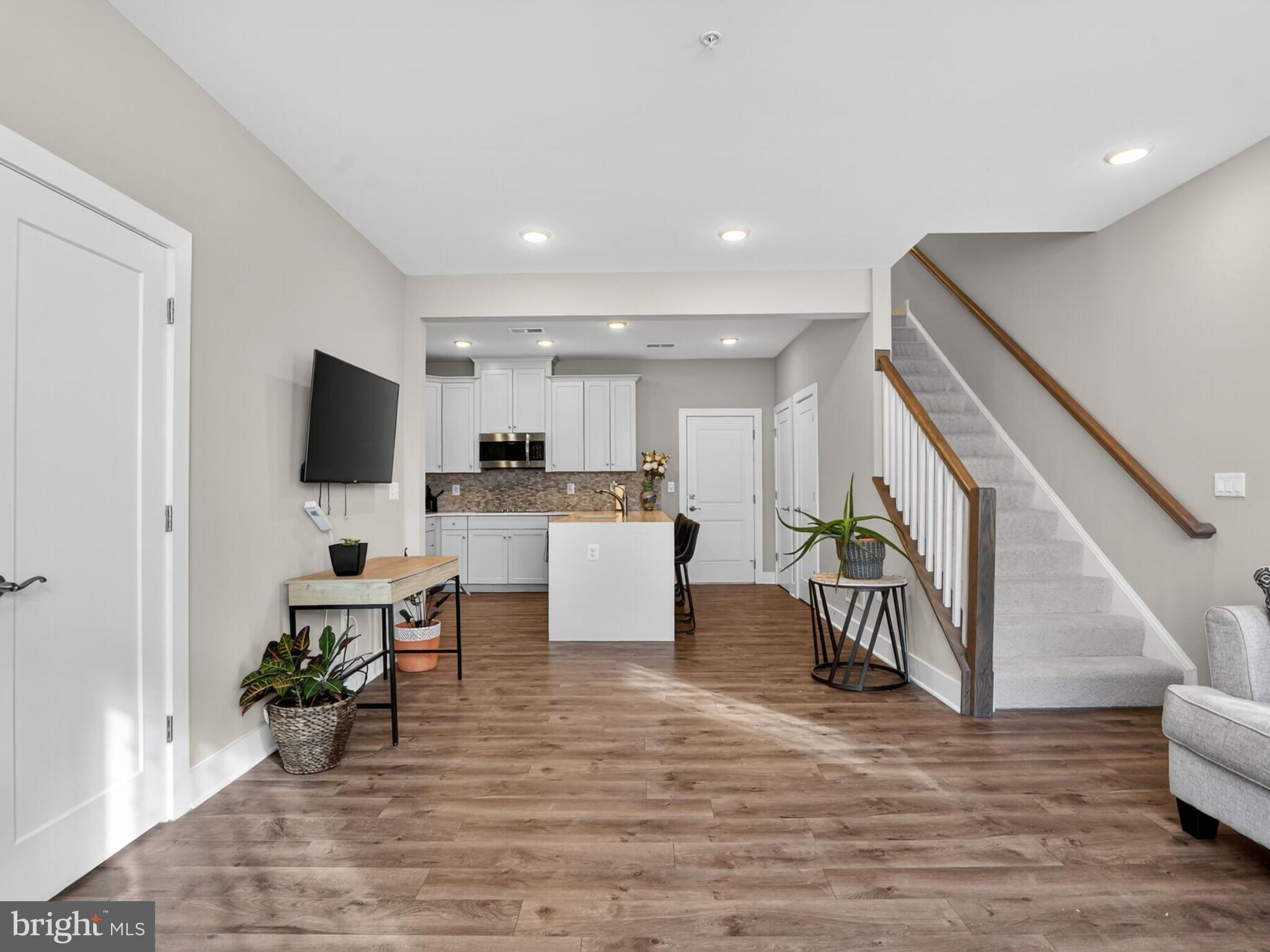55 Silverway Drive, Unit 48 Herndon, VA 20170 - Photo 4 of 31 LVP Flooring throughout Main Level