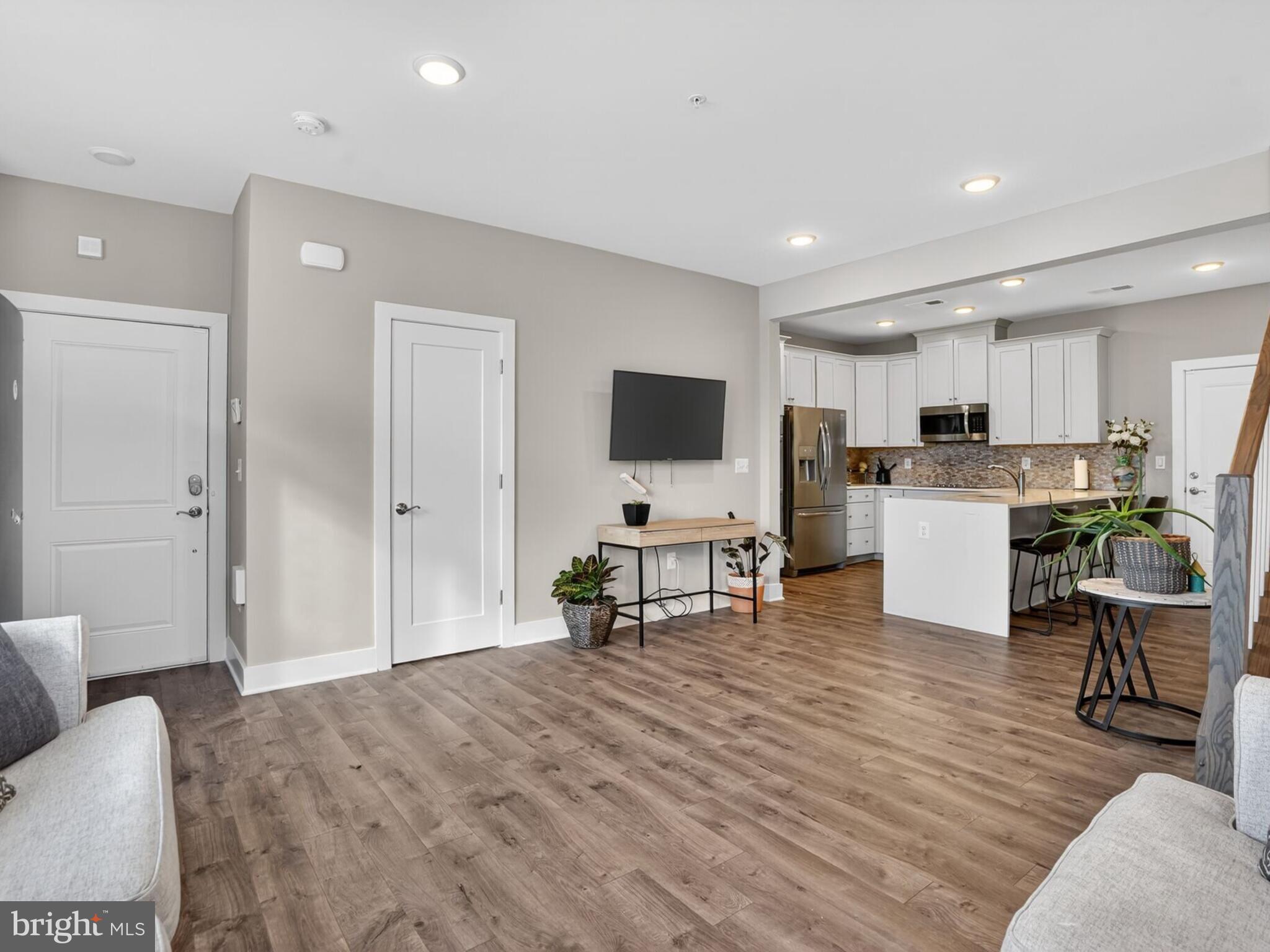 55 Silverway Drive, Unit 48 Herndon, VA 20170 - Photo 5 of 31 Half Bathroom Located behind Door, Left of TV