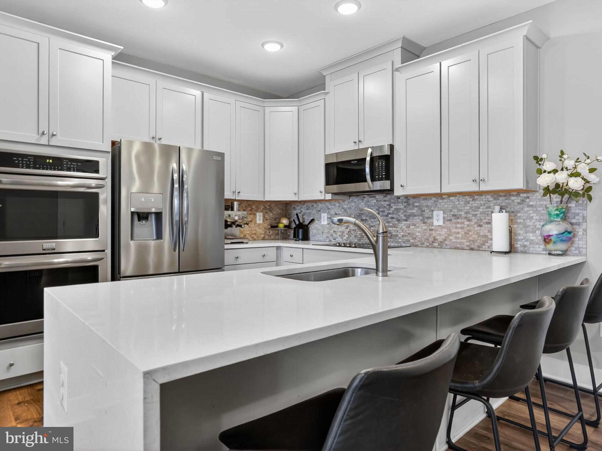 55 Silverway Drive, Unit 48 Herndon, VA 20170 - Photo 10 of 31 Waterfall Quartz Counters are an Elegant Touch