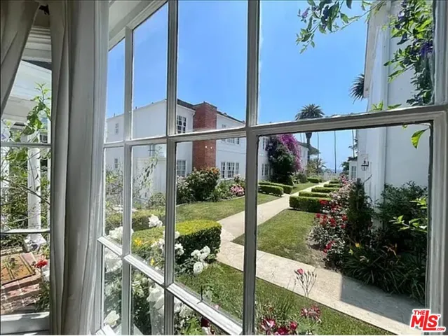 a view of a potted plant sitting in front of a house