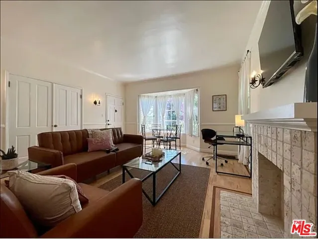 a kitchen with a refrigerator a stove a sink and a cabinets