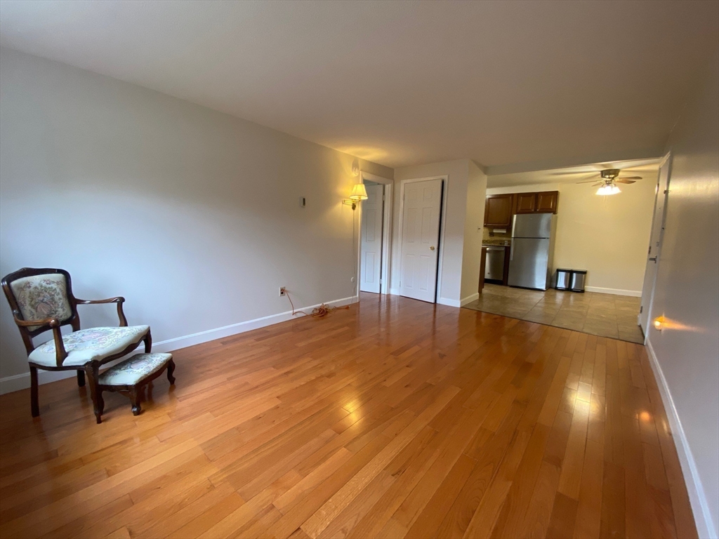 8 Old Colony Lane, Unit 2 Arlington, MA 02476 - Photo 6 of 12 a view of a room with wooden floor