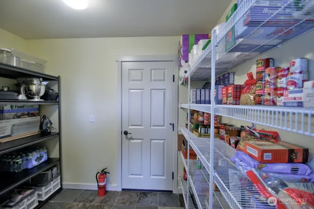 a room with lots of books and a book shelf