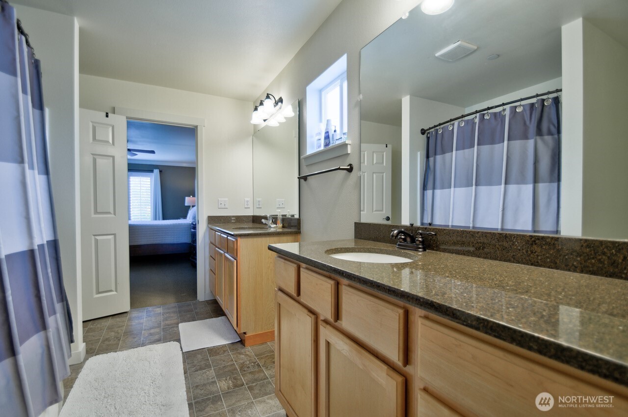 3172 Sheaser Way DuPont, WA 98327 - Photo 17 of 34 a kitchen with a sink and cabinets