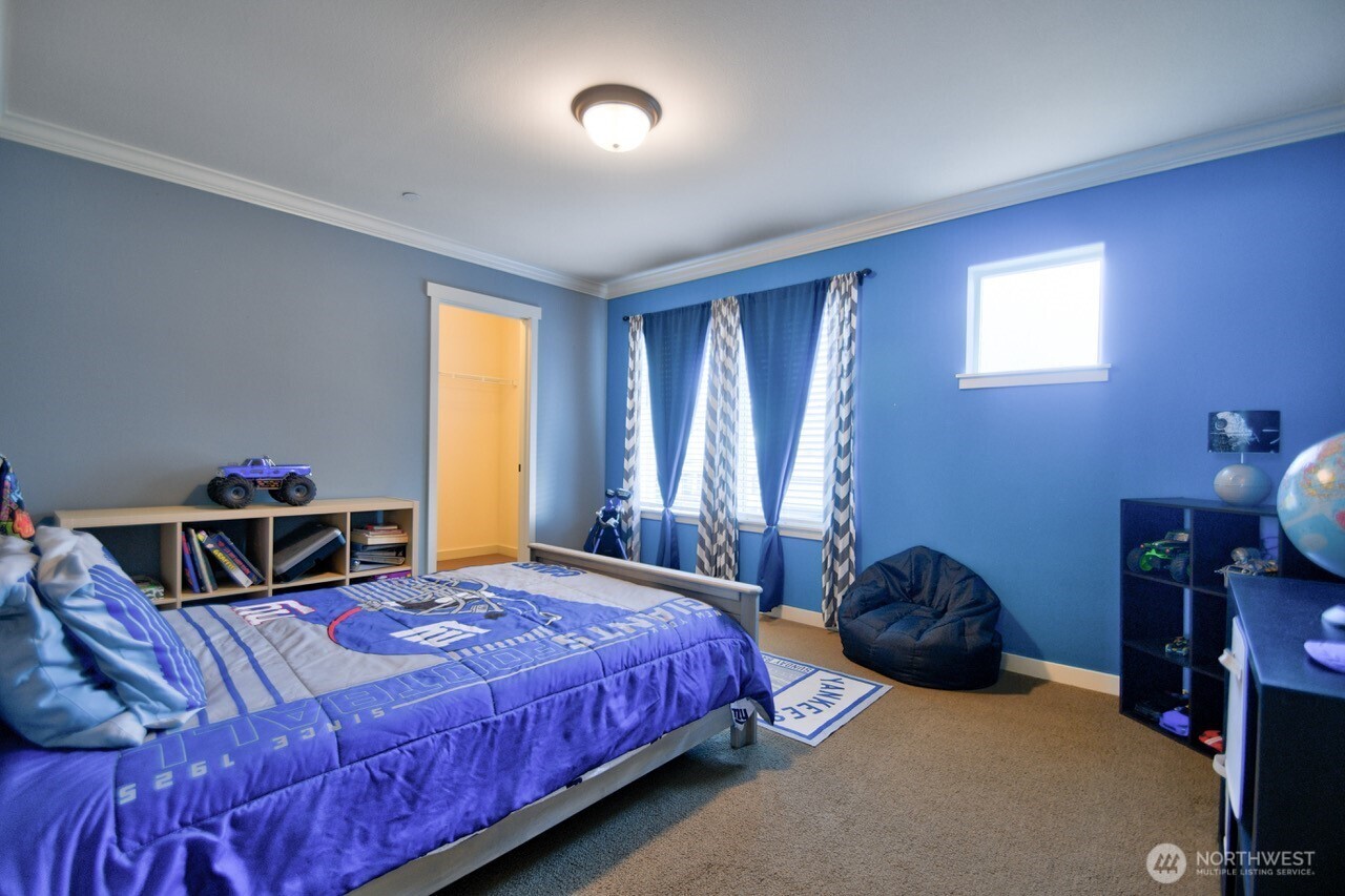 3172 Sheaser Way DuPont, WA 98327 - Photo 21 of 34 a bedroom with a bed and a window