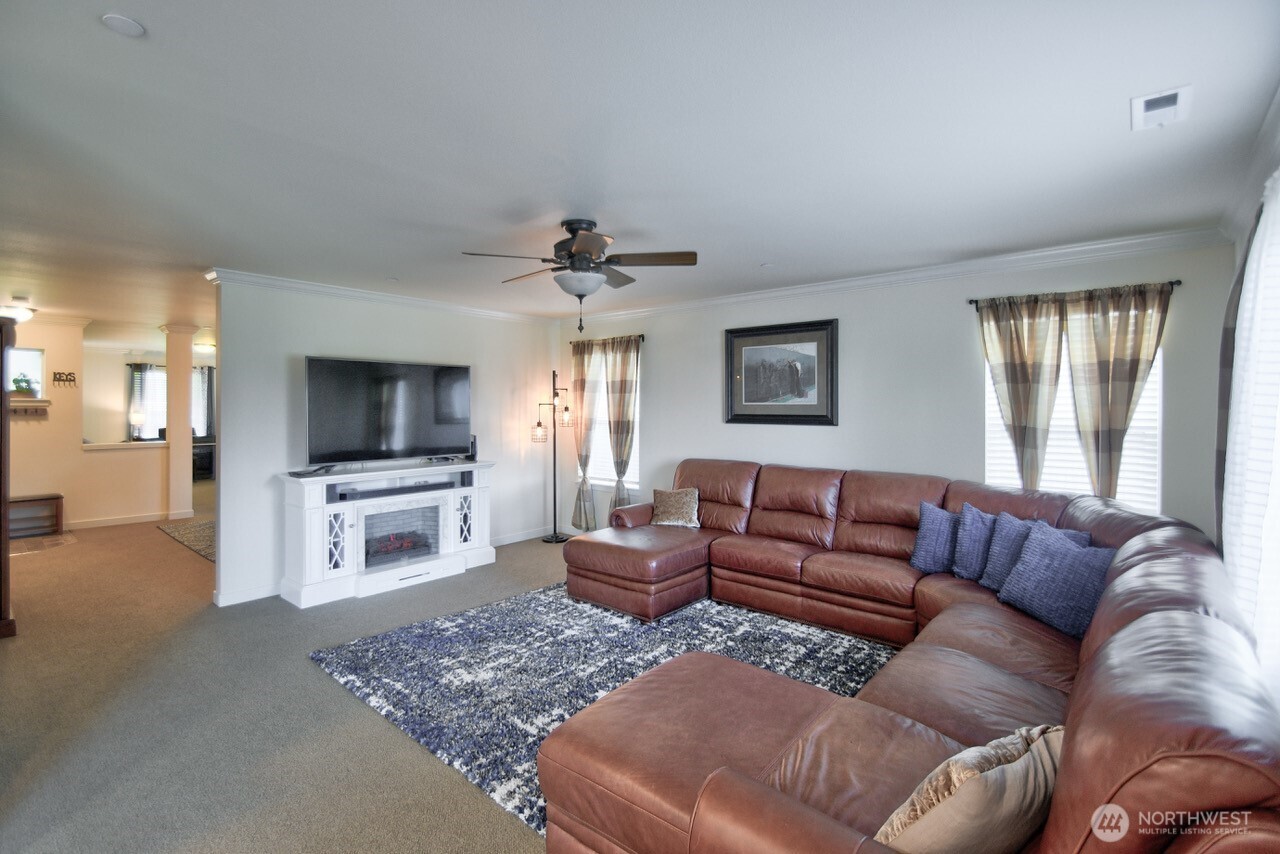 3172 Sheaser Way DuPont, WA 98327 - Photo 4 of 34 a living room with furniture and a flat screen tv