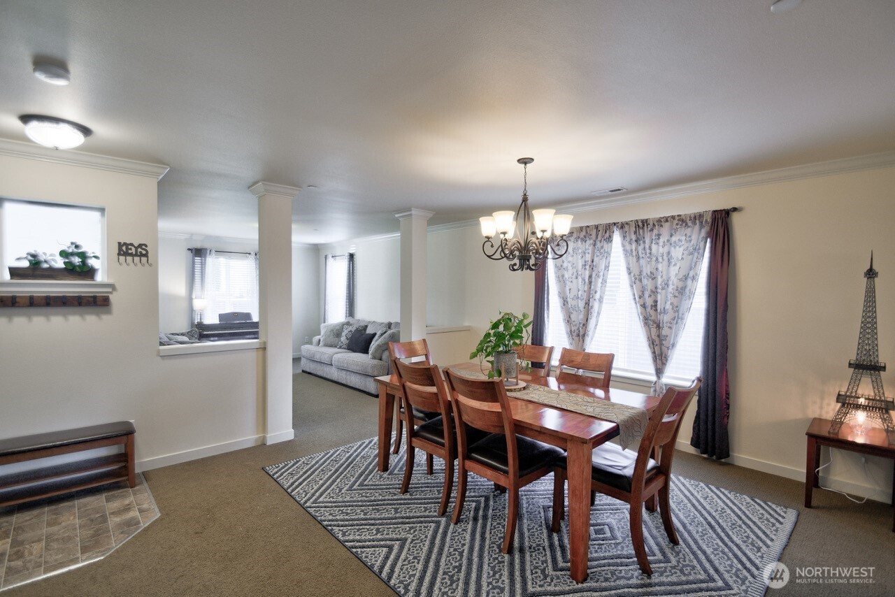 3172 Sheaser Way DuPont, WA 98327 - Photo 7 of 34 a view of a dining room with furniture