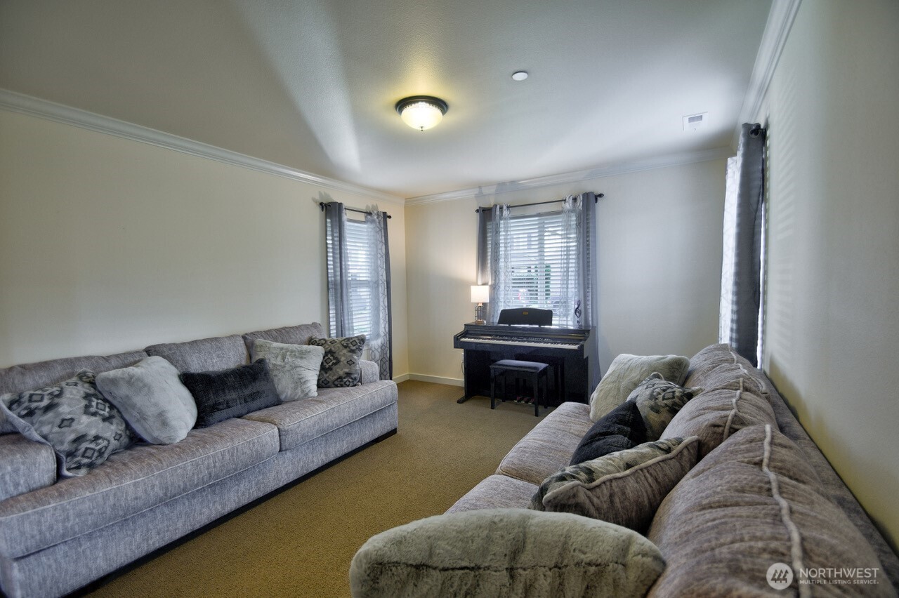 3172 Sheaser Way DuPont, WA 98327 - Photo 8 of 34 a living room with furniture and a couch