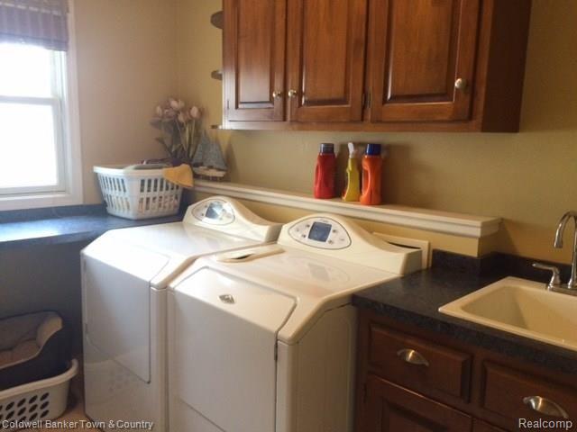4770 Golf Club Road Howell, MI 48843 - Photo 38 of 59 Laundry Tub and lots of cupboard space in Laundry Room