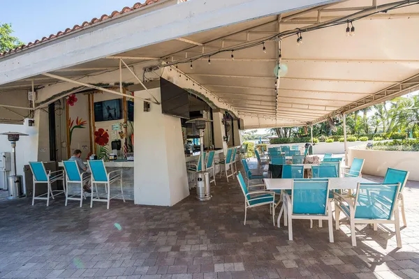 a view of a chairs and table in the patio
