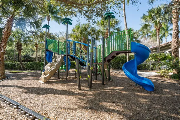 a view of a swimming pool with lounge chairs