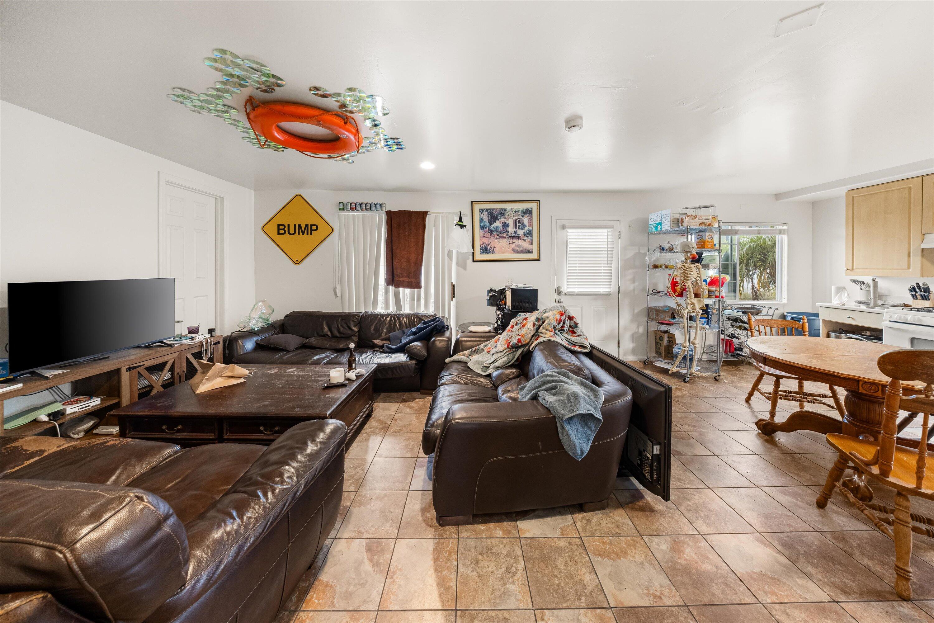 6670 Sueno Road Isla Vista, CA 93117 - Photo 12 of 20 a living room with furniture and a flat screen tv