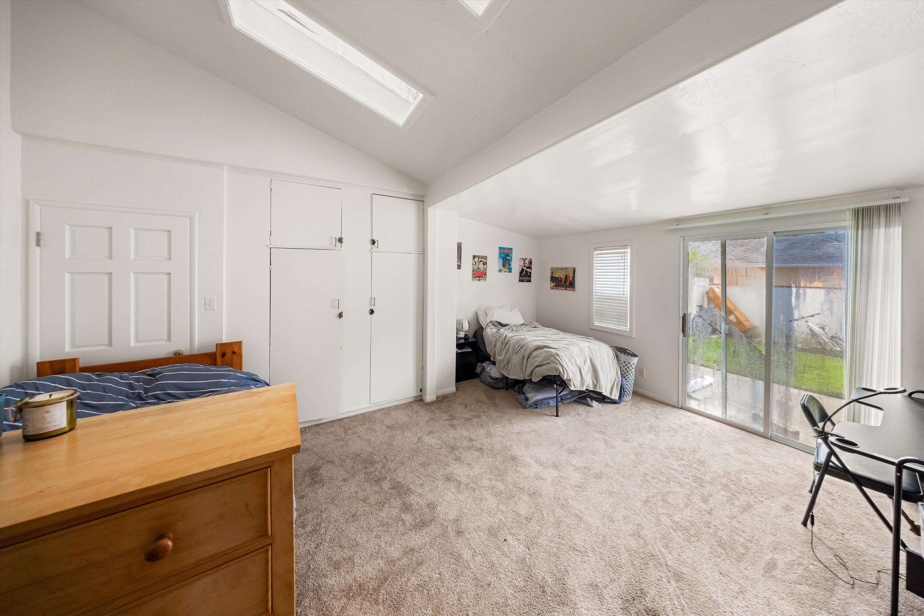 6670 Sueno Road Isla Vista, CA 93117 - Photo 14 of 20 a bed room with a bed and a chair