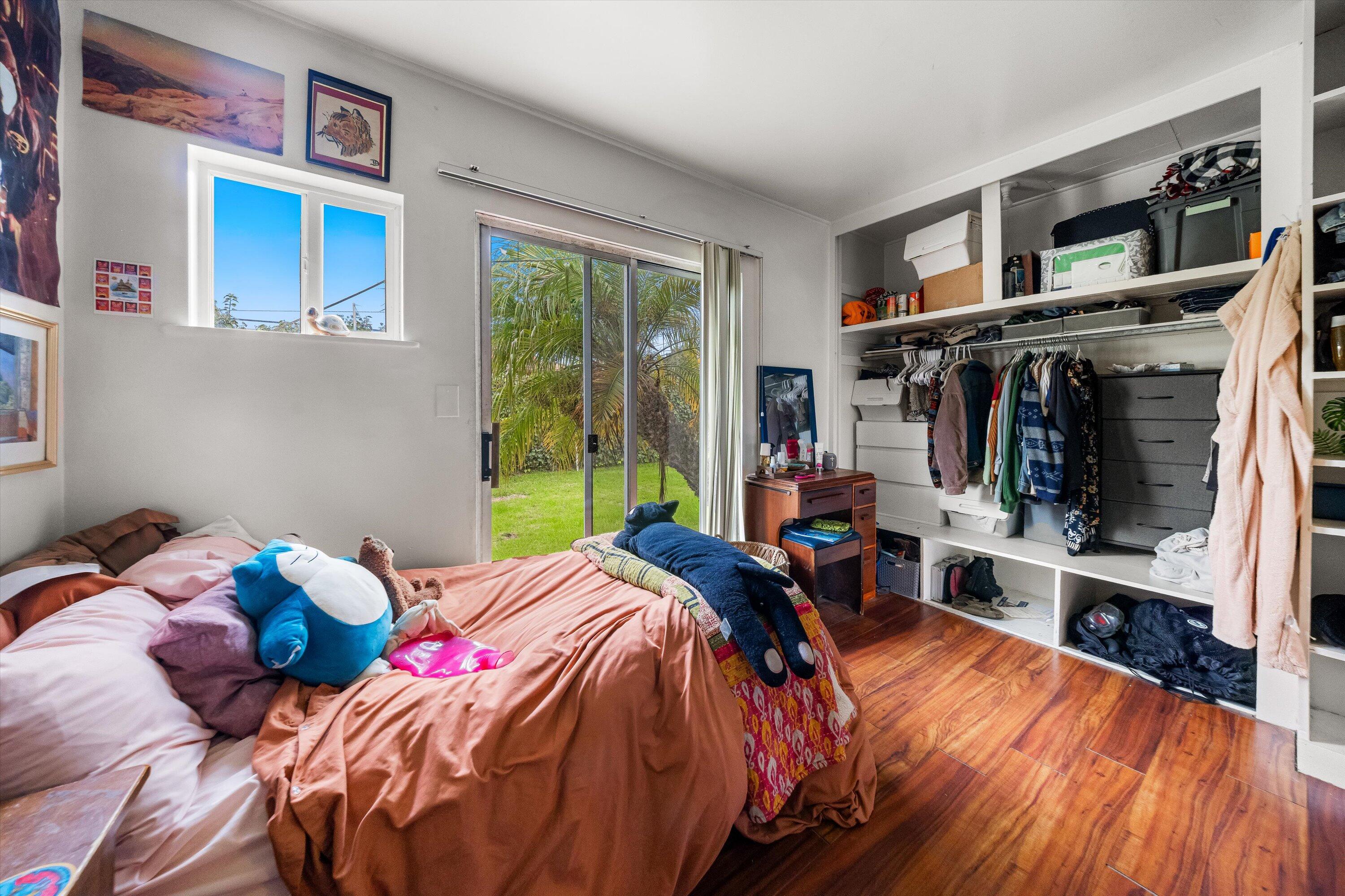 6670 Sueno Road Isla Vista, CA 93117 - Photo 9 of 20 a bedroom with a bed and large windows