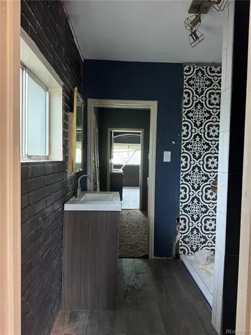 a view of living room with granite countertop furniture and a fireplace