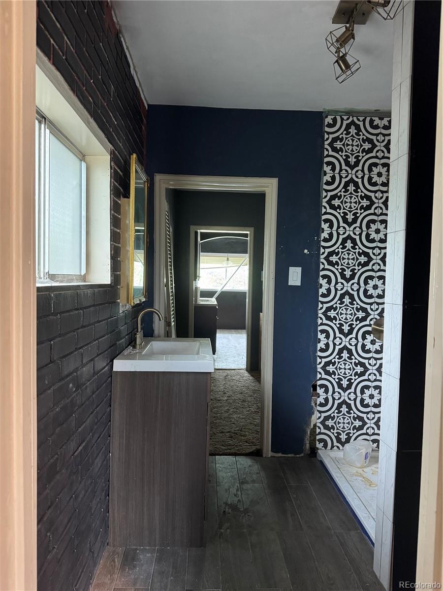 312 Pinon Street Walsenburg, CO 81089 - Photo 4 of 13 a view of living room with granite countertop furniture and a fireplace