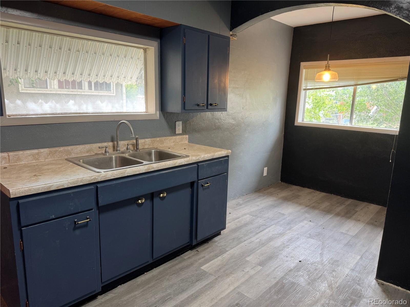 312 Pinon Street Walsenburg, CO 81089 - Photo 8 of 13 a kitchen with a sink and large window