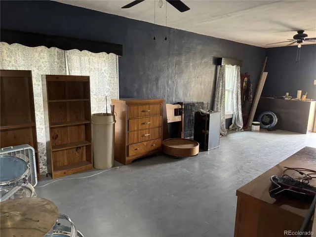 a room with furniture and a flat screen tv