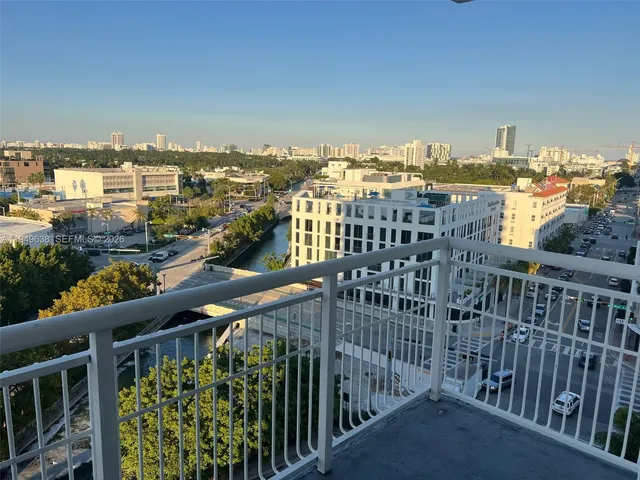 a view of buildings from a balcony