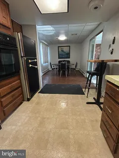 a lobby with furniture and a flat screen tv