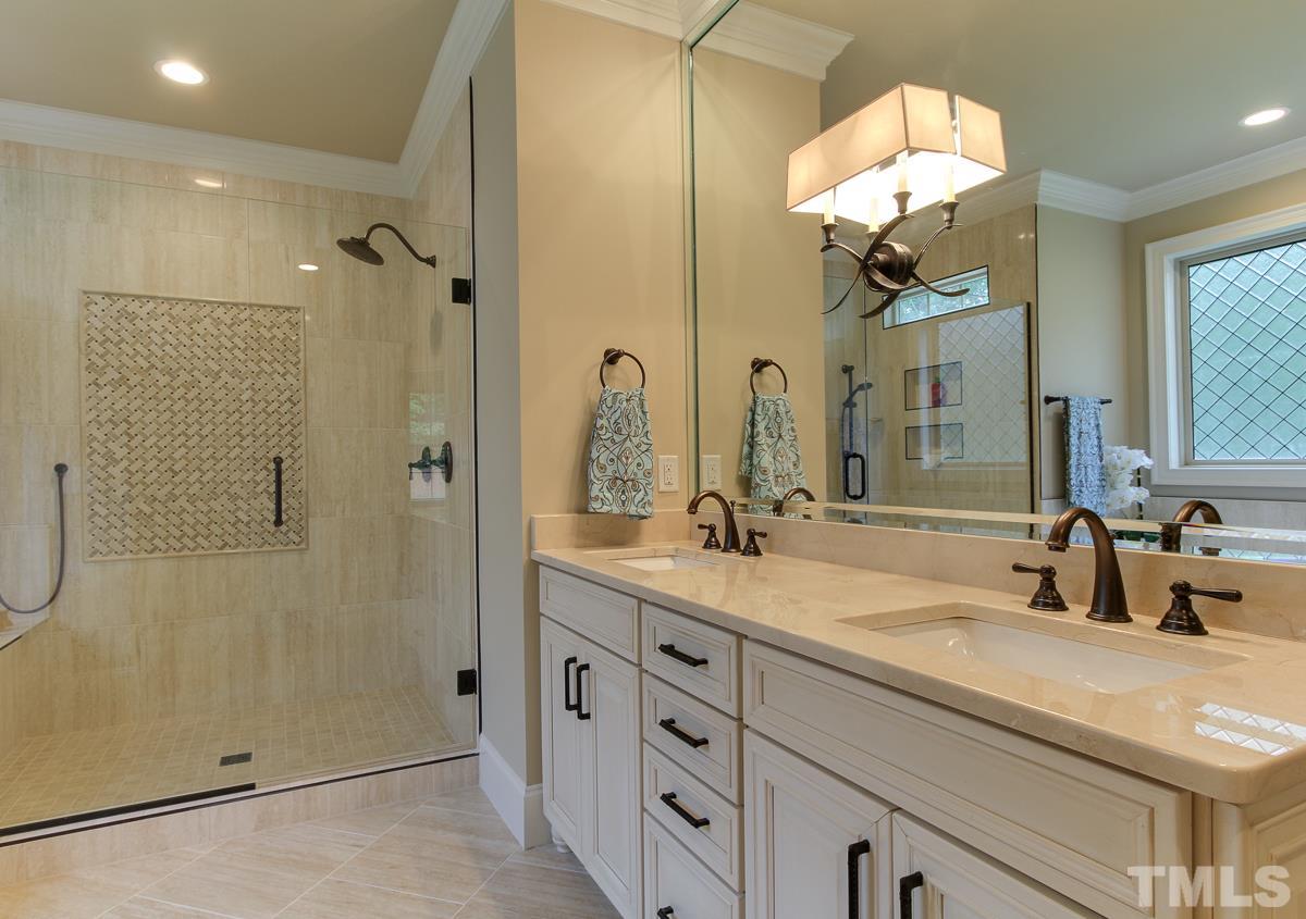 128 Chatterson Drive Raleigh, NC 27615 - Photo 15 of 25 a bathroom with a double vanity sink mirror and shower