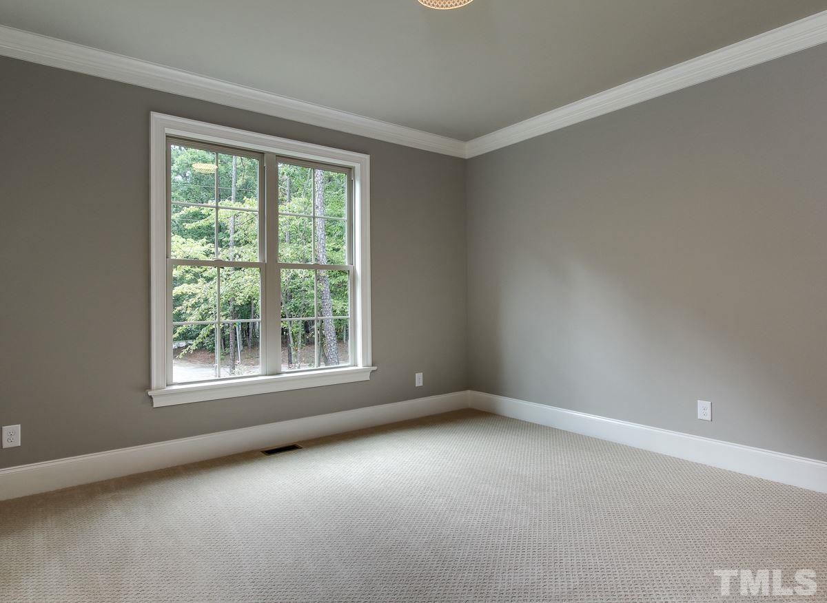 128 Chatterson Drive Raleigh, NC 27615 - Photo 16 of 25 an empty room with a window