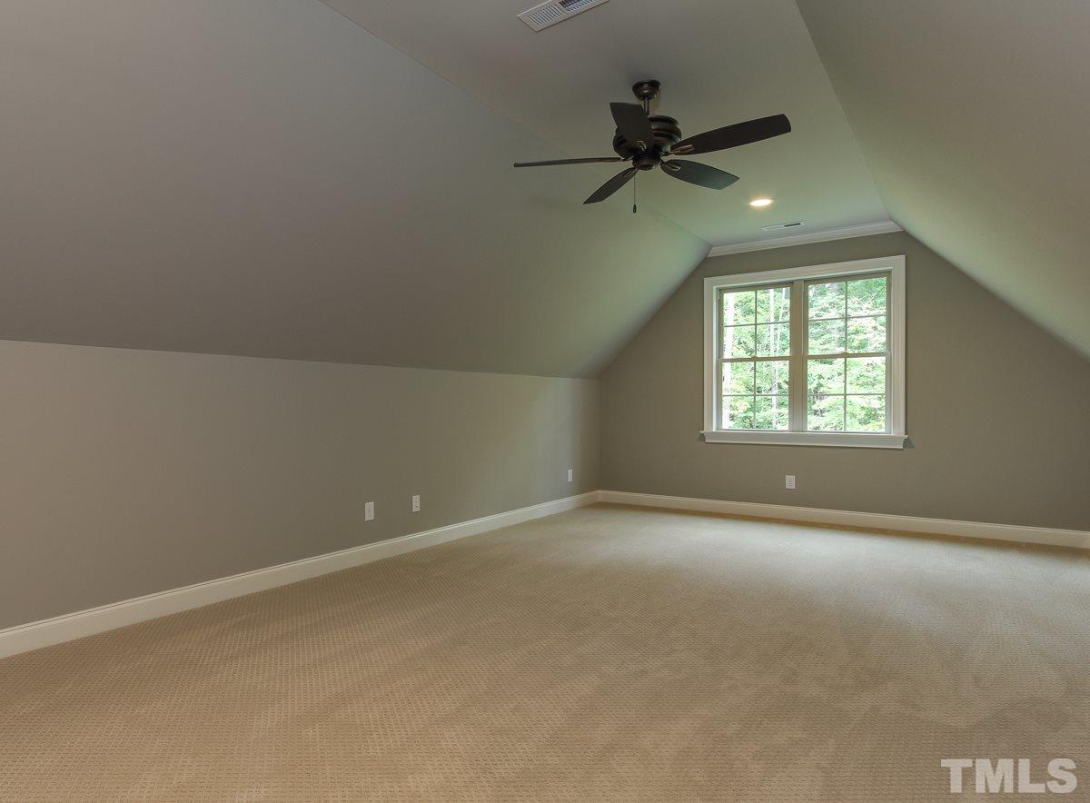 128 Chatterson Drive Raleigh, NC 27615 - Photo 19 of 25 an empty room with a window and a fan