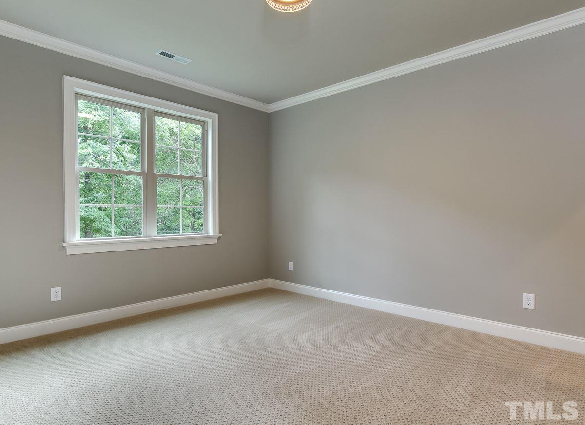 128 Chatterson Drive Raleigh, NC 27615 - Photo 20 of 25 an empty room with a window